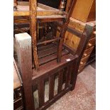 A pair of stained wooden garden armchairs