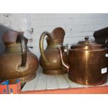 A copper kettle and 2 copper jugs
