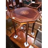An Edwardian marquetry inlaid octagonal occasional table with shaped x frame stretcher and splayed