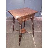 An Edwardian occasional table with turned legs and lower x frame stretcher, height 65cm.