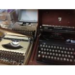An Everest portable typewriter, a Kolibri, and a Boots portable typewriter