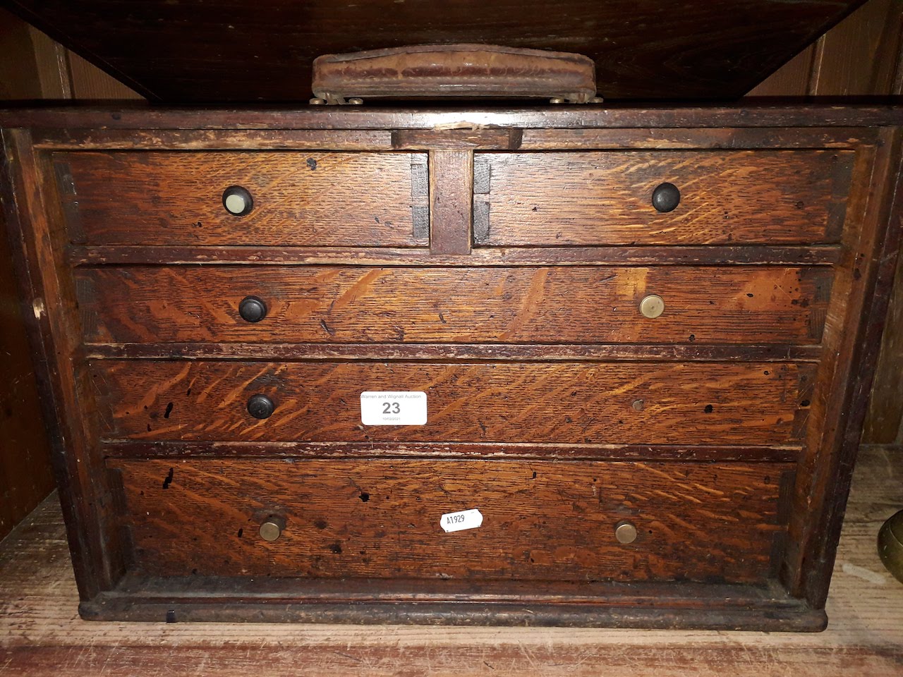 A wooden 5 drawer tool cabinet