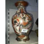A Japanese Satsuma vase decorated with figures,