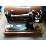 A Singer sewing machine in wooden case