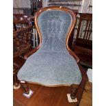 A Victorian spoon back nursing chair, width 63cm, depth 73cm & height 88cm.