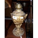 A guilt spelter oil lamp with colonial scene
