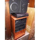 A Sony hifi system and speakers in pine cabinet.