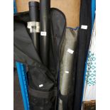 A fishing rod, carbon poles, keep net, and 2 fishing boxes including reels