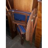 A stained teak patio table and pair of directors chairs.