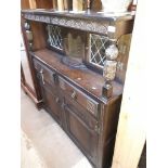 A reproduction oak court cupboard