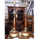 A pair of turned mahogany and metal table lamps, height 80cm.