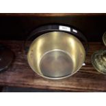 A brass jam pan