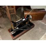 A vintage cased Singer electric sewing machine - B.U.K 12E