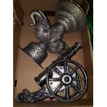 Box containing metal elephant and cannon