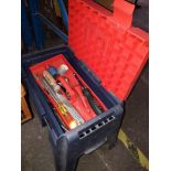 A toolbox seat with tools