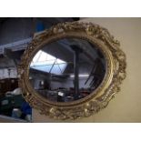 Ornate oval mirror