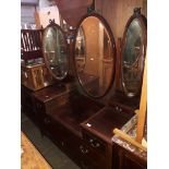 An Edwardian inlaid mahogany triple mirror dressing table.