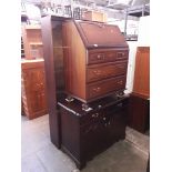 A reproduction HiFi cabinet and a bureau.