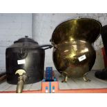 A brass coal scuttle and a cast metal stove kettle