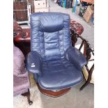 A blue leather swivel armchair