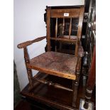 A child's rush seated rocking chair, height 65cm.
