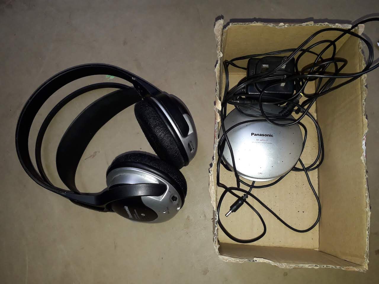 A set of Panasonic stereo headphones with chargng dock