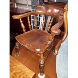 An elm captain's chair, width 66cm, depth 60cm & height 78cm.