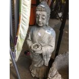 A Buddha style concrete garden figure