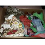 A box of ladies silk scarves and gloves and other material