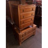 An oak chest of drawers and matching triple mirror dressing table.