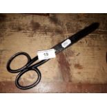 A pair of dressmakers scissors