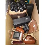 Box of cameras and binoculars