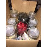 A box of jars containg assorted buttons