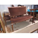 An Edwardian inlaid mahogany salon suite comprising a two seater settee and two armchairs