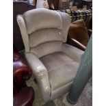 A manual reclining armchair