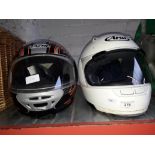 2 motor cycle helmets