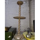 A wooden twist stem smokers stand
