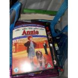 A bag containing DVDs/CDs and children's books
