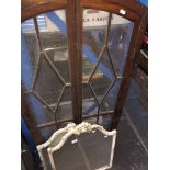 A pair of matching mirrors, and a set of glazed arched cabinet doors