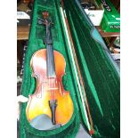 A violin in a case with a bow