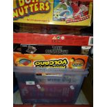 A box of assorted games and puzzles