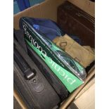 A box containing briefcase, laptop bag, picnic cool bag etc