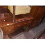 A 1930s walnut dressing table with triple mirror and matching tallboy.