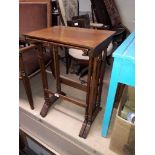 An Edwardian nest of two oak tables