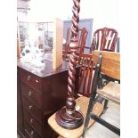 A stained pine twist pillar standard lamp.