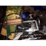 Box including a child's miniature sewing machine and mangle and various kitchen ware.