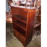 A reproduction mahogany open bookcase with lower cabinet, width 78cm, depth 30cm & height 133cm.