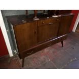 A mid 20th century teak cocktail sideboard by Remploy on tapered legs, L136cm, D47cm H95cm.