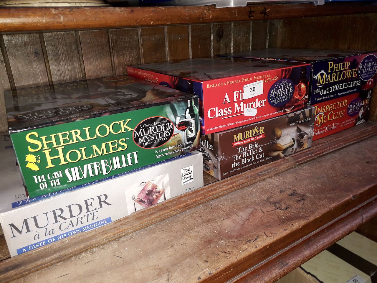 6 boxes of Murder Mystery games