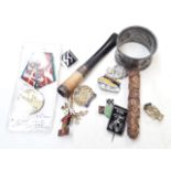 A mixed lot including an Arts & Crafts pewter serviette ring, a cheroot holder, a carved needle